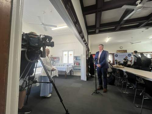 Richard Barker being interviewed by 9 News in the Braille House hall