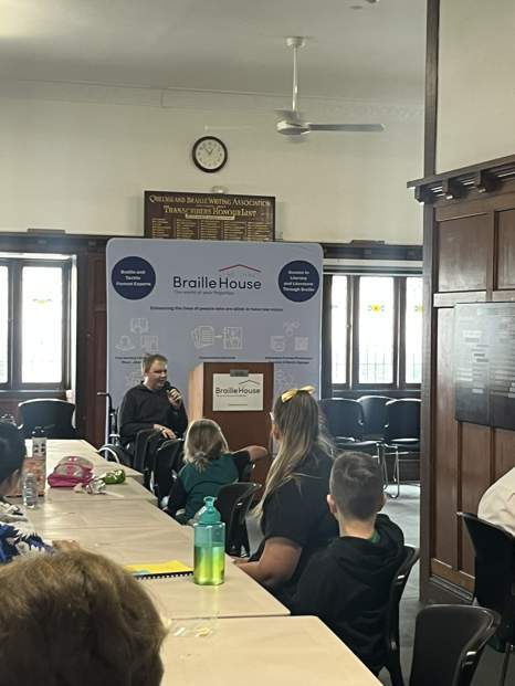 Jonathan Craig giving a speech at the Braille Literacy Challenge
