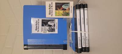 A display of all four volumes of the braille version of The Story of My Life by Helen Keller in the Braille House Library