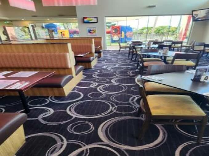 Photograph of a large area in the restaraunt amongst tables which is easy to move through