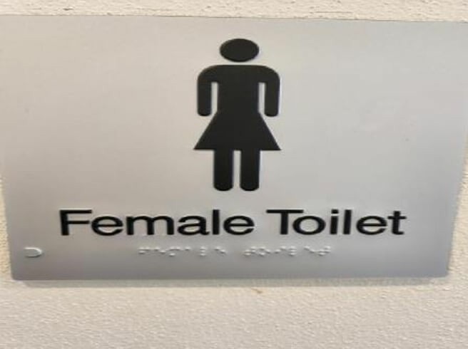 Photograph of the limited signage in Braille for the toilets