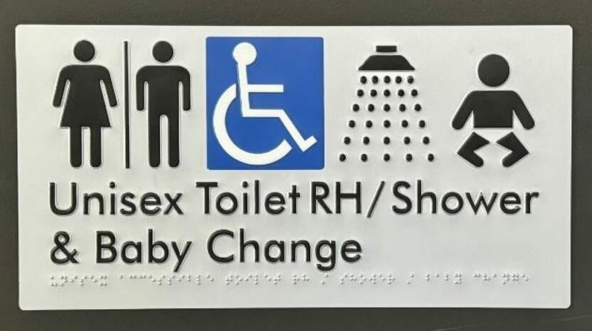 Photograph of toilet / shower sign with Braille