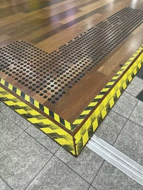 Photograph of elevated floor with high visibility marking