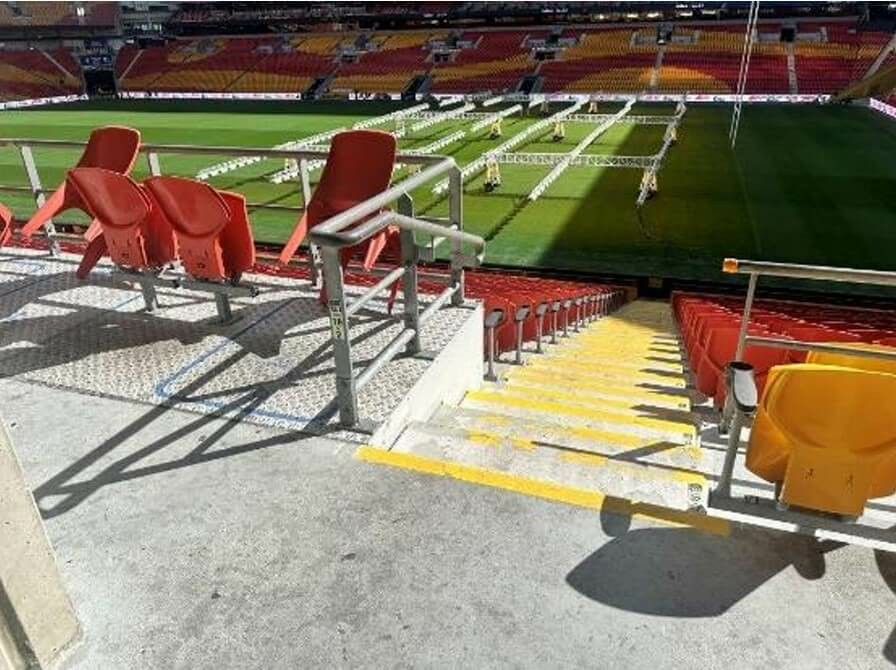 Photograph of Stairs leading to seats would benefit from a repaint of the colour contrast. No TGSIs.