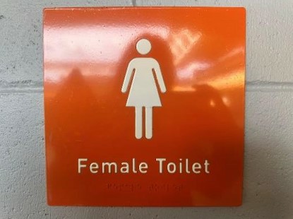 Photograph of further signage with Braille